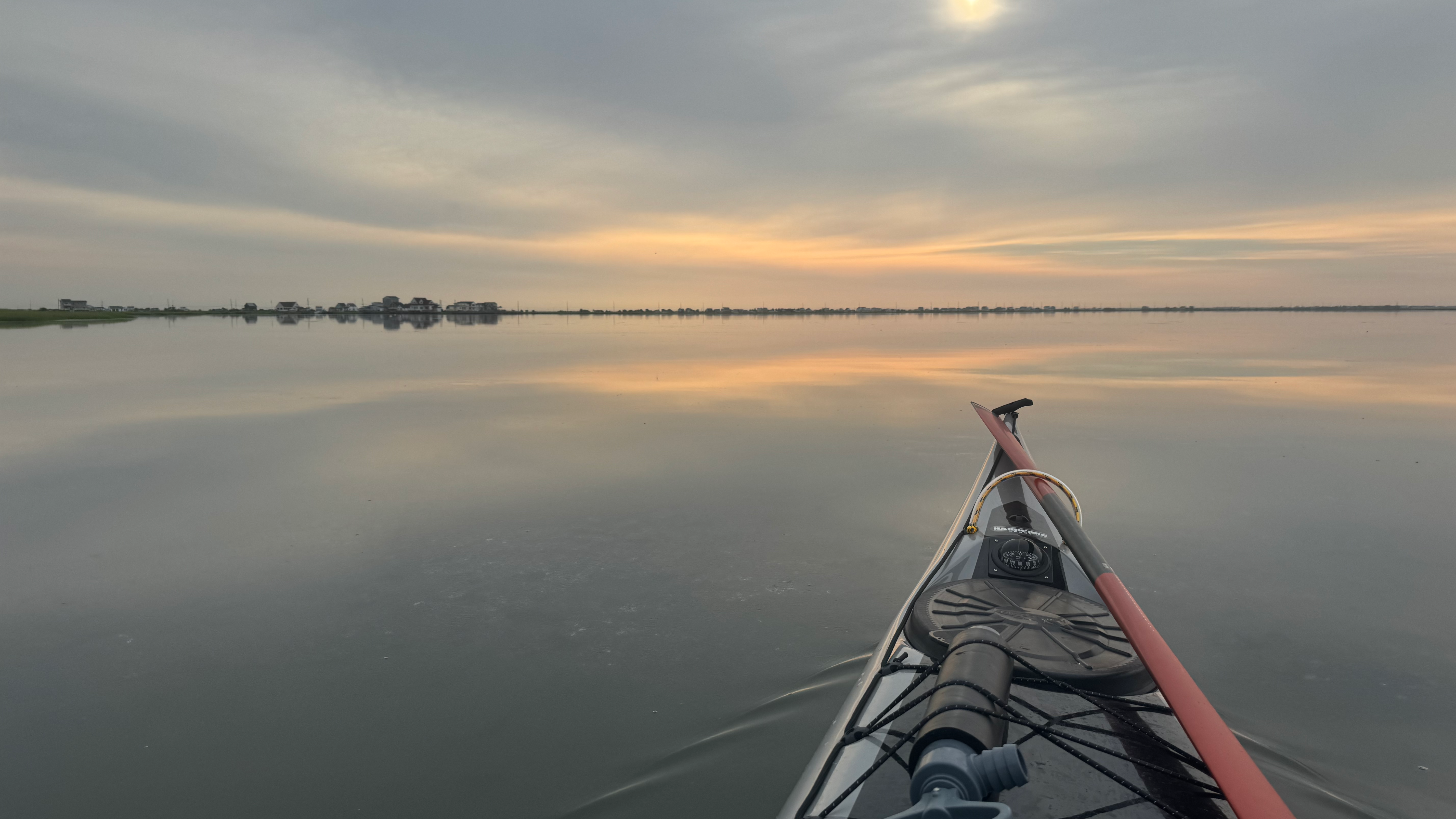 Sunrise over back bay in a kayak